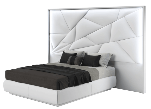 Modern bed with geometric headboard on a white background
