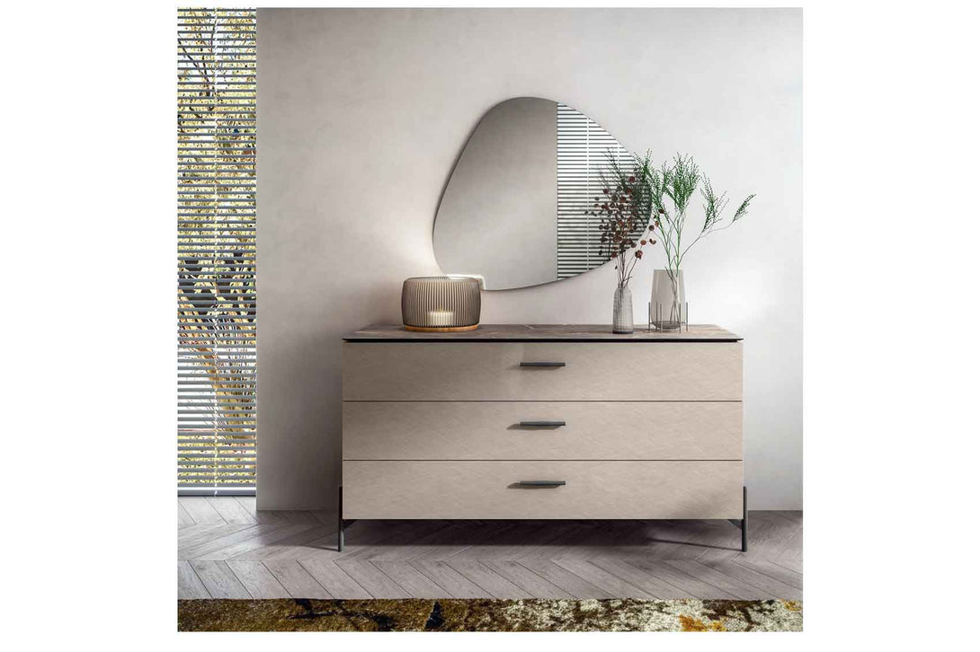 Modern dresser with decorative items in a minimalistic room
