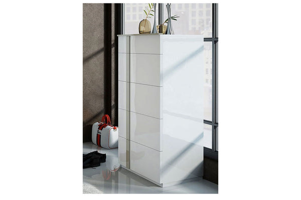 Modern white chest with 2-high gloss doors in a minimalistic setting