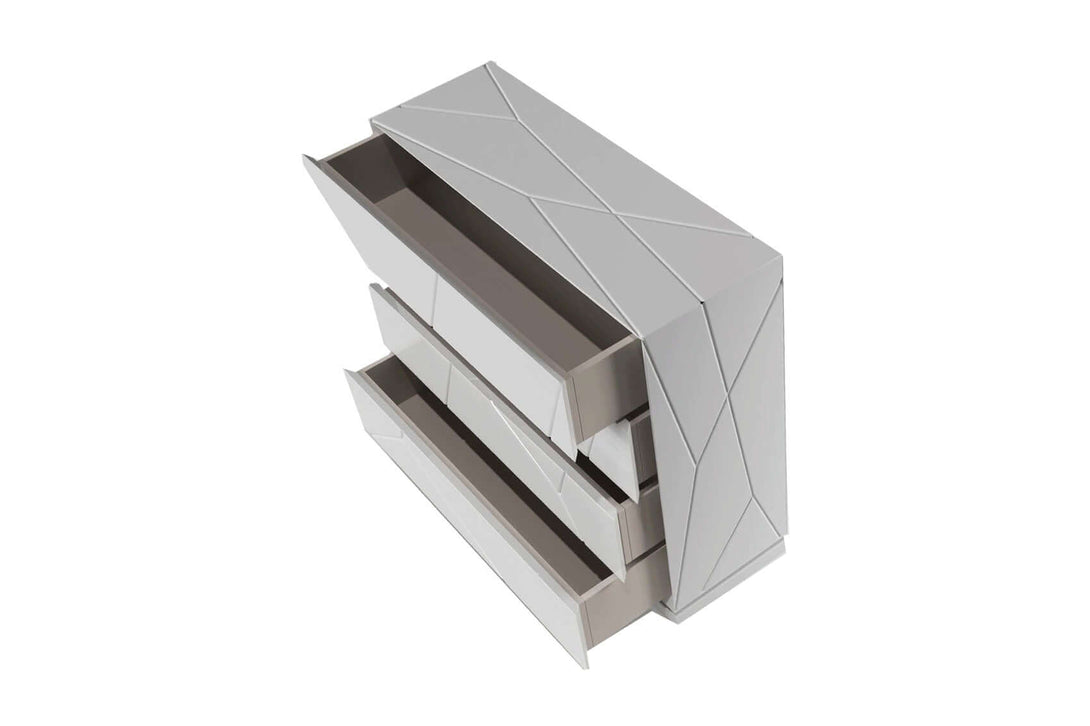Modern white dresser with geometric design on a white background with drawers open to display interior of drawer