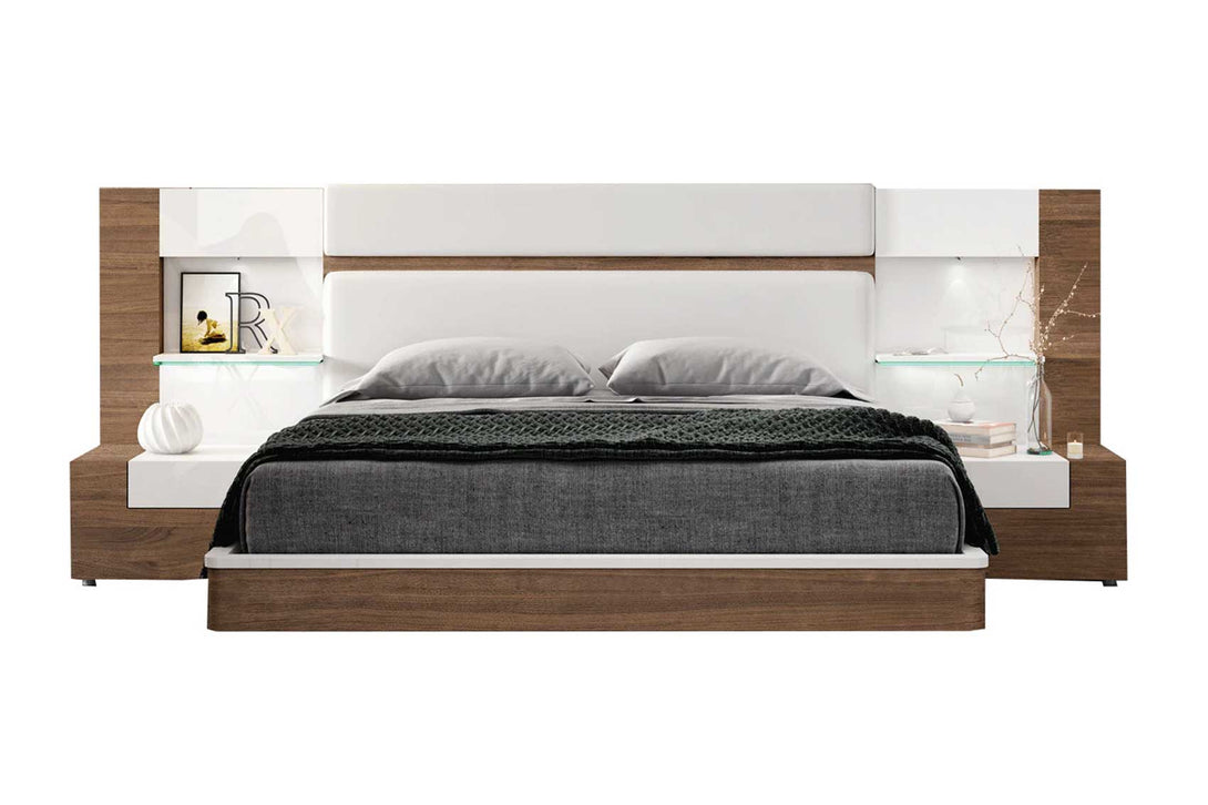 Modern bed with wooden frame and white headboard on a white background