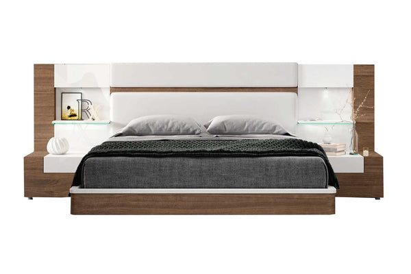 Modern bed with wooden frame and white headboard on a white background