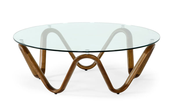 Glass coffee table with wavy wooden legs on a white background