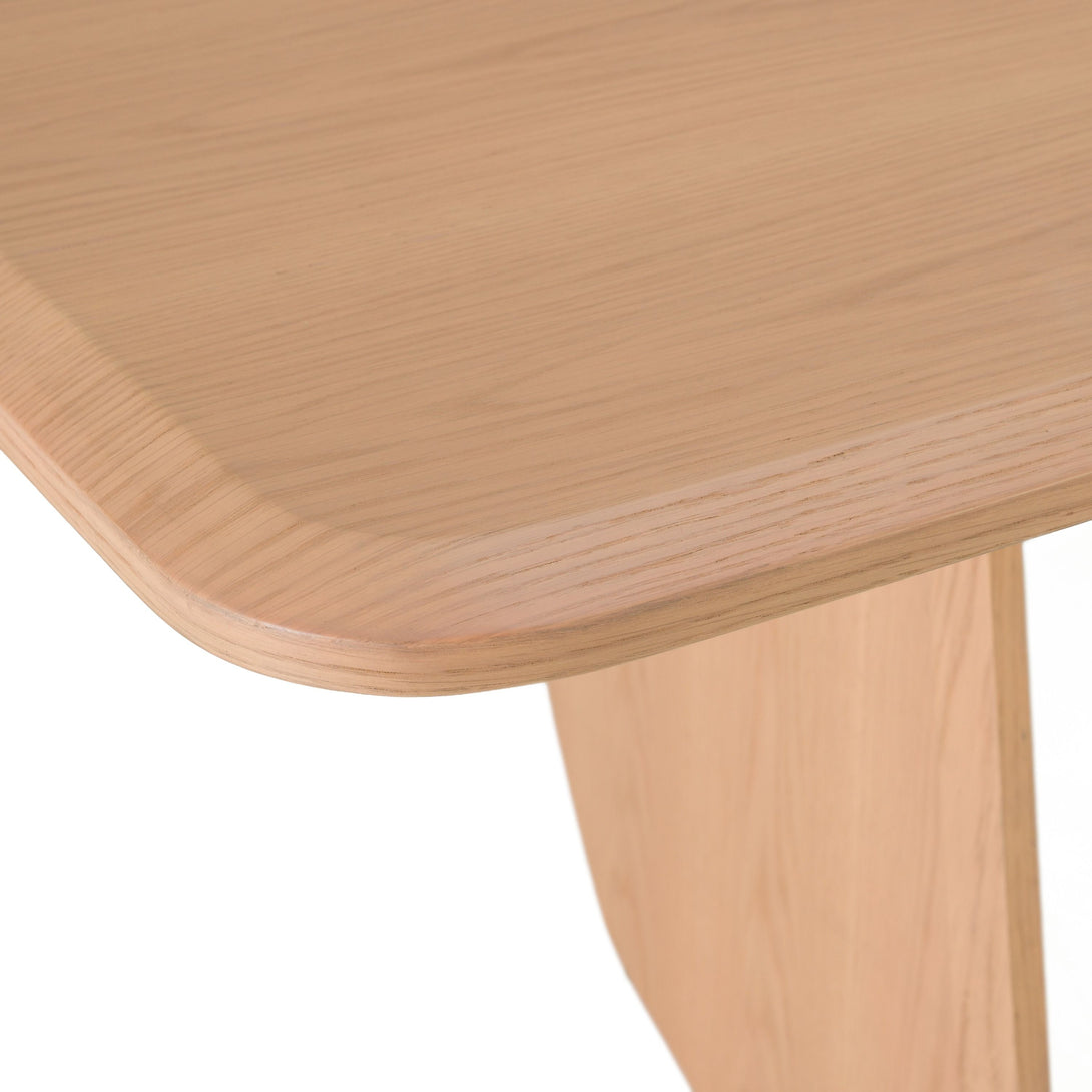 Close-up of a wooden table corner on a white background