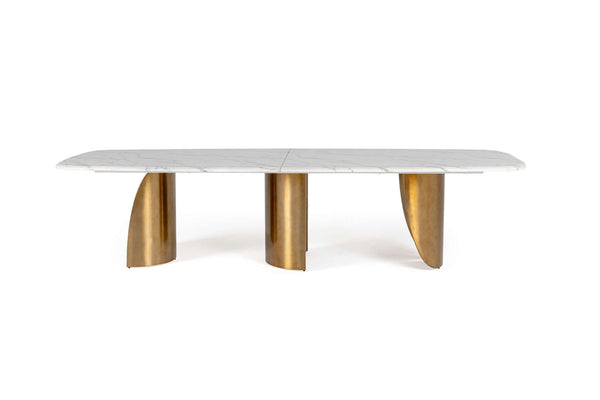 Dining table with marble top and gold metal legs on a white background