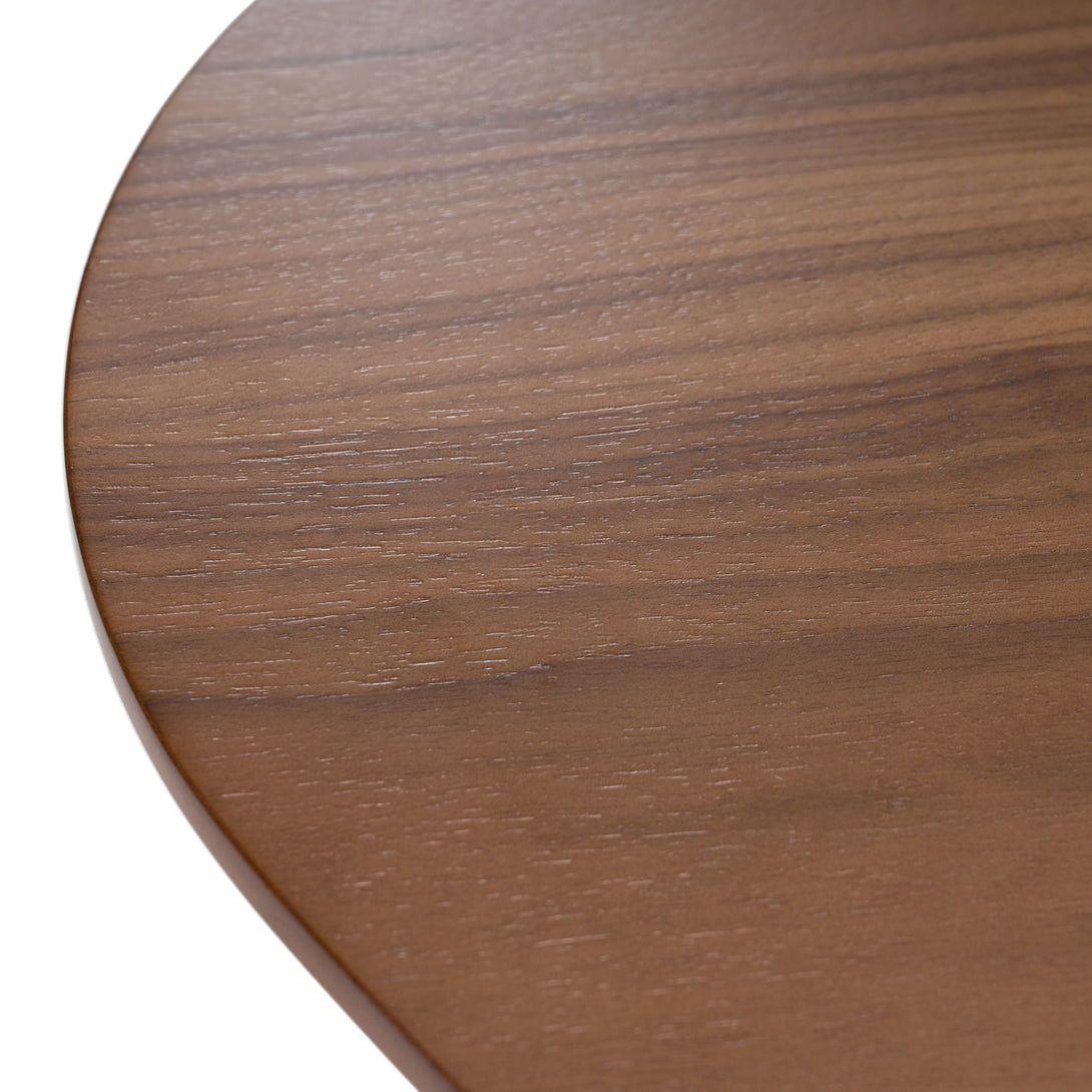 Modrest Truman - Mid-Century Modern Walnut Extendable Dining Table - Close-up view of dining table top finish and grain on a white transparent background