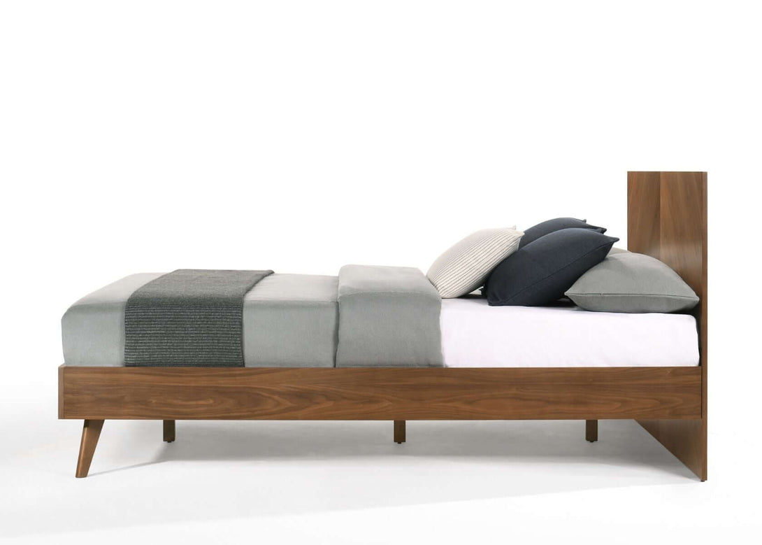 Nova Domus Kamela - Modern Walnut Bed - Side view of the bed on a white transparent background